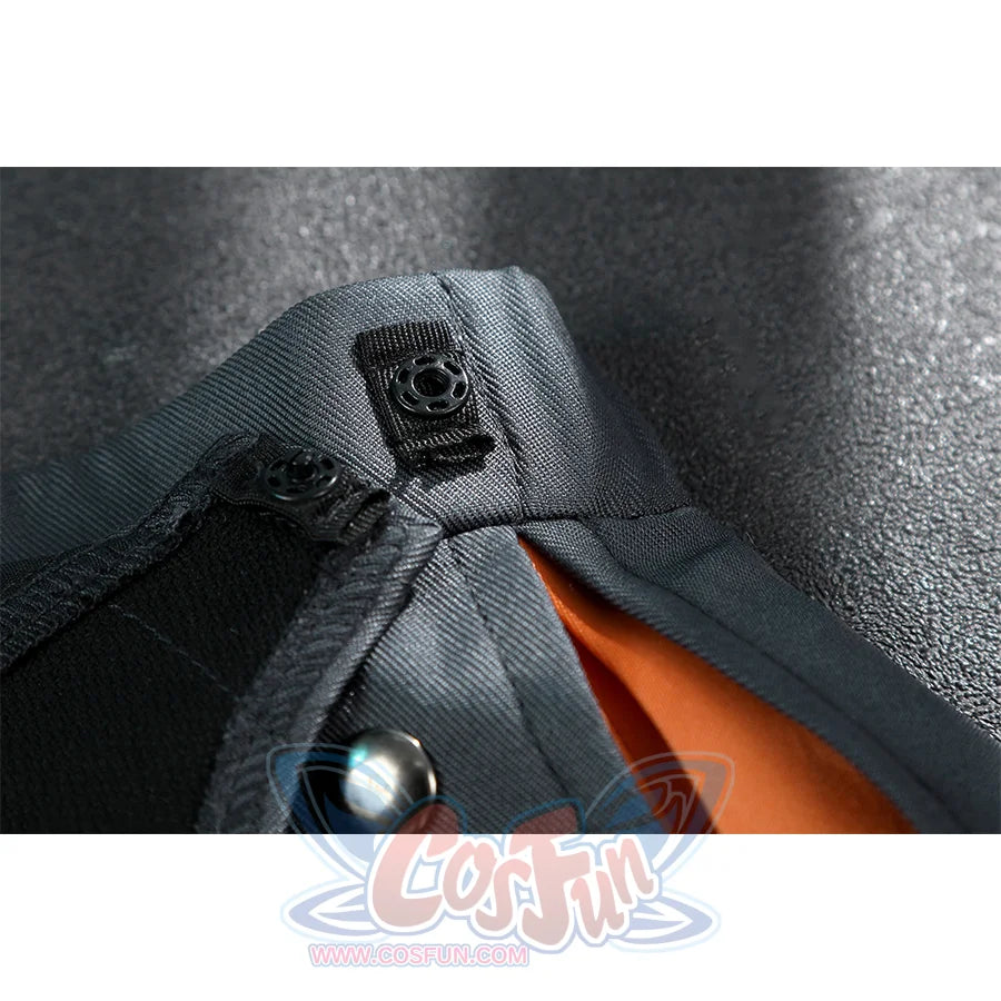 Zhao cosplay costume skirt button close-up showing black square snap fastener with silver stud on gray fabric and orange lining