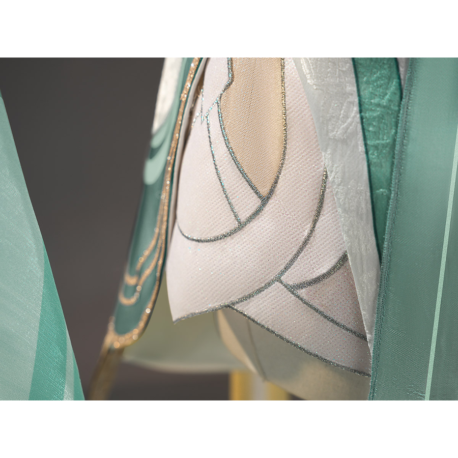 Zibai cosplay costume dress right side detail with beige fabric, teal trim, and silver stitching
