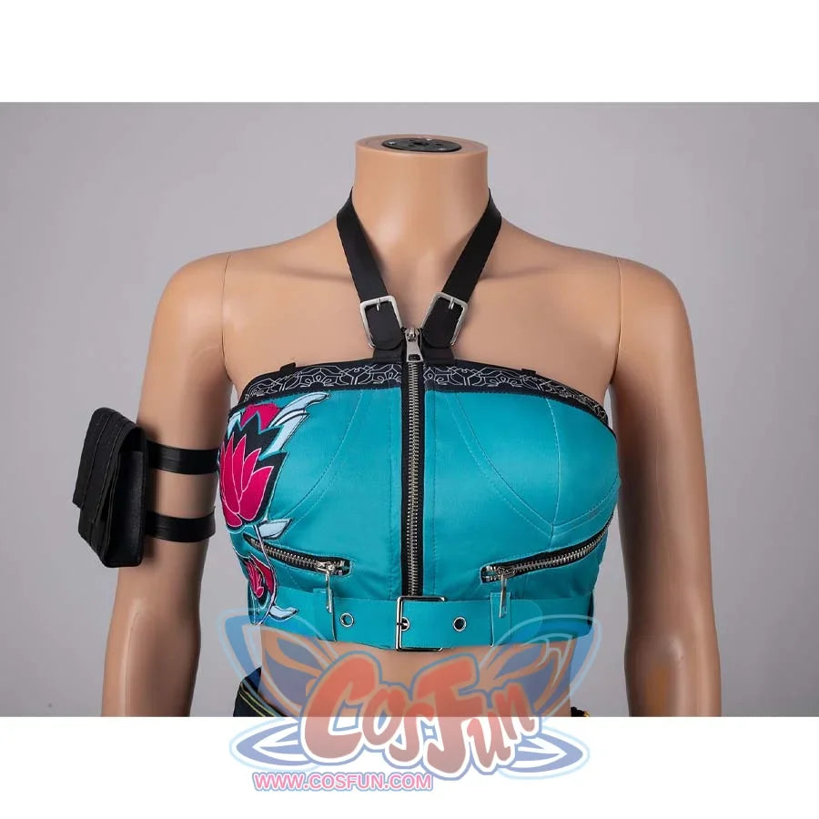 Detailed close - up of the turquoise crop top from the Zoey cosplay costume, highlighting zippers, straps, and floral patterns.