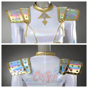 Showcases the front and back of Zoey’s top, highlighting iridescent shoulder pads with gold studs, tassels, and a gold - trimmed neckline with a geometric design.