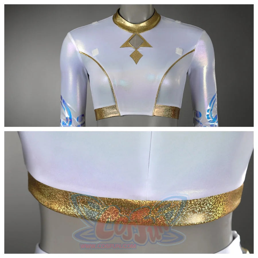 Displays the front of Zoey’s crop top with a gold geometric neckline design and the shimmering gold - trimmed hem, from two perspectives.
