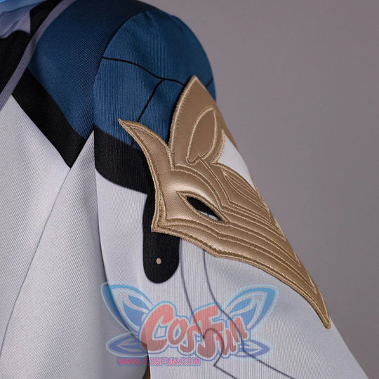 Close-up of Genshin Impact Aether cosplay costume shoulder guard with gold bird shape, blue fabric, and black sleeve