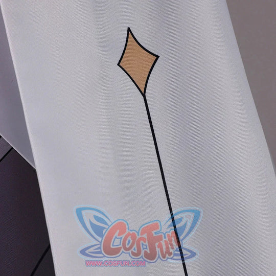 Close-up of Genshin Impact Aether cosplay costume sleeve with white fabric, gold diamond motif, and black line detail