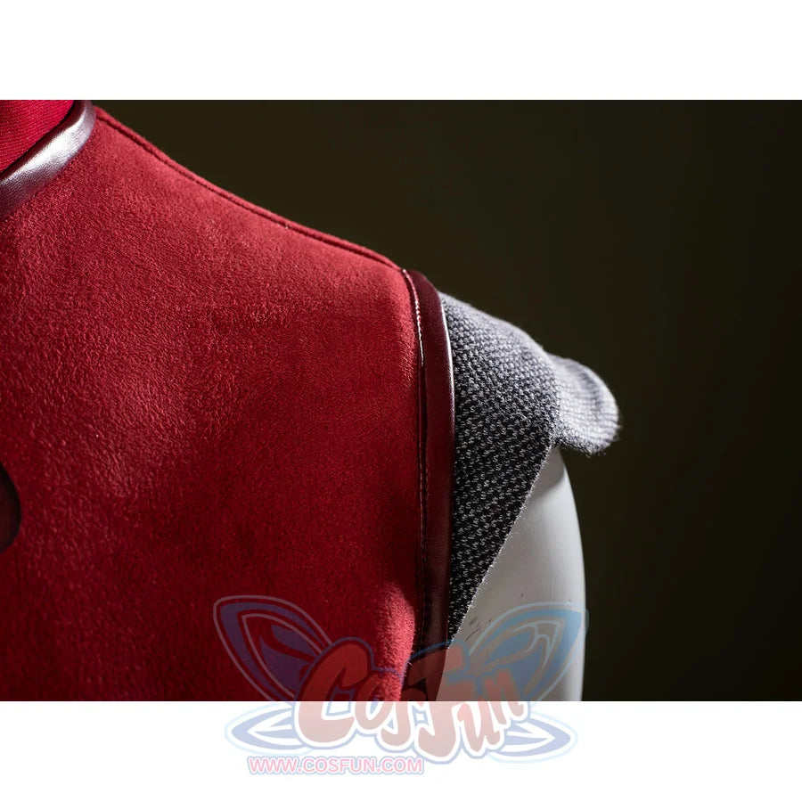 Ahsoka Tano cosplay shoulder guard detail sets a gray textured cap against red dress fabric.