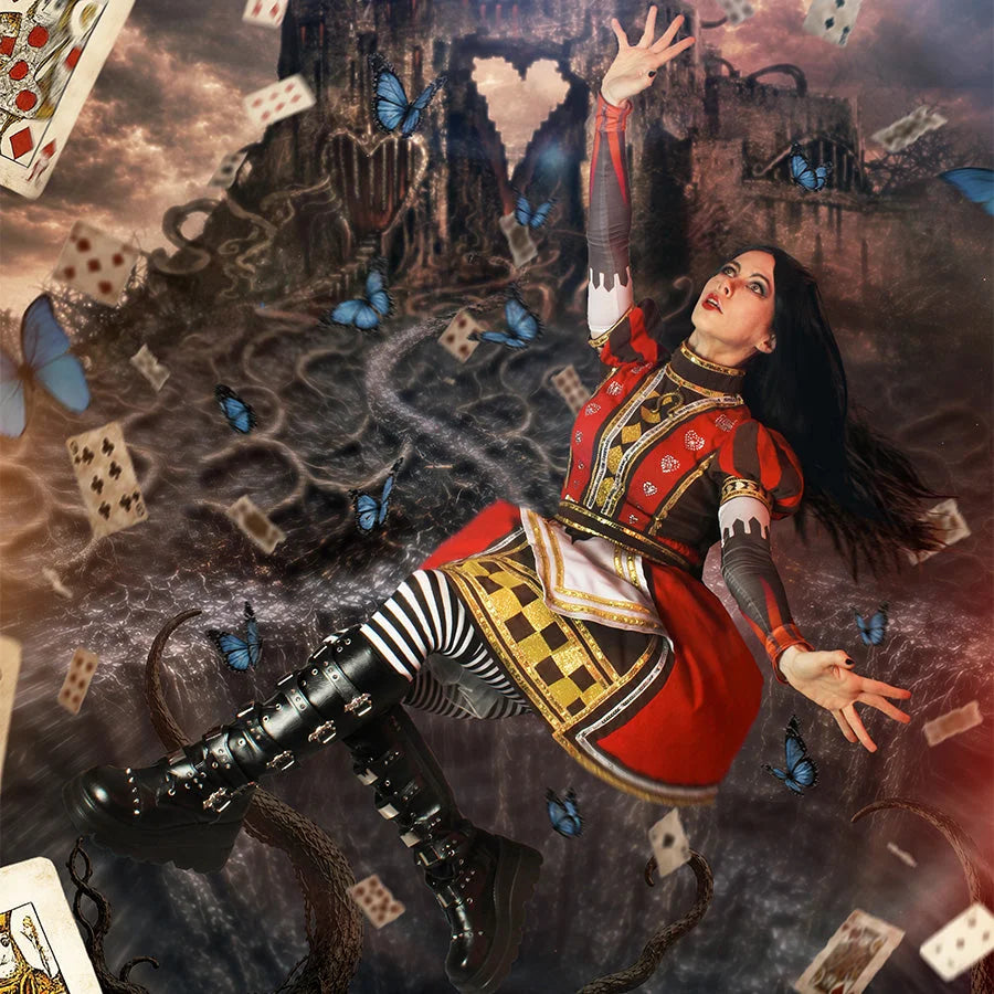 COSFUN Alice: Madness Returns Alice cosplay royal dress arcs in red layers above striped socks.