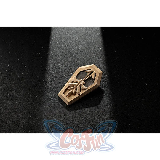 Genshin Impact Amber cosplay armband emblem accessory appears as a carved gold-tone piece.