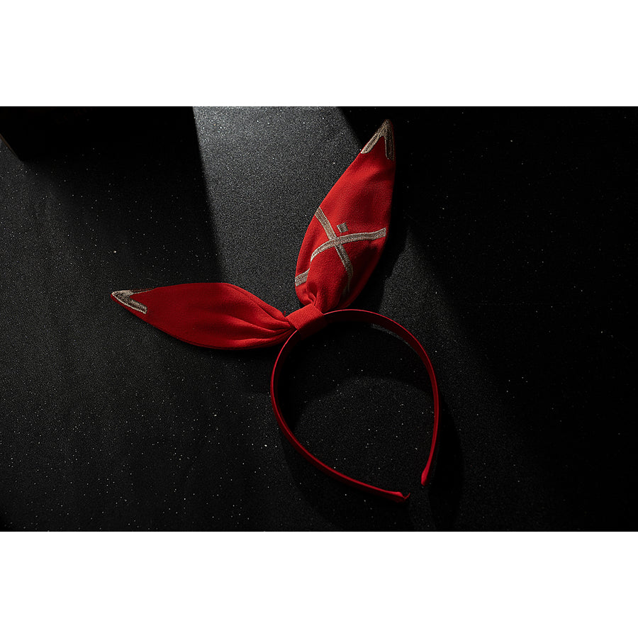 Genshin Impact Amber cosplay bunny ear headband flat lay shows red fabric ears on a slim red band.