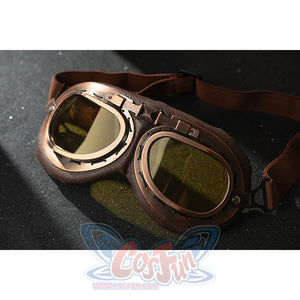 Genshin Impact Amber cosplay goggles close-up shows brown straps and translucent yellow lenses.