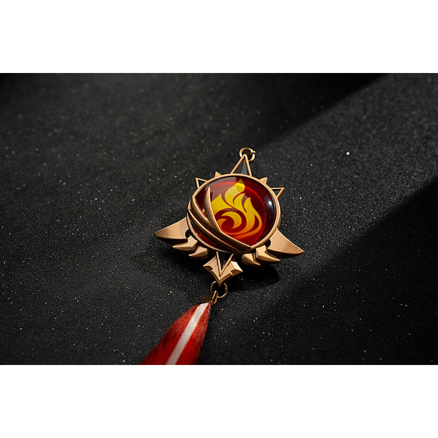 Genshin Impact Amber cosplay Pyro vision close-up centers a red flame emblem in a gold-tone frame.