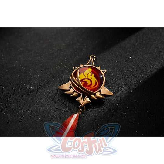 Genshin Impact Amber cosplay Pyro vision close-up centers a red flame emblem in a gold-tone frame.