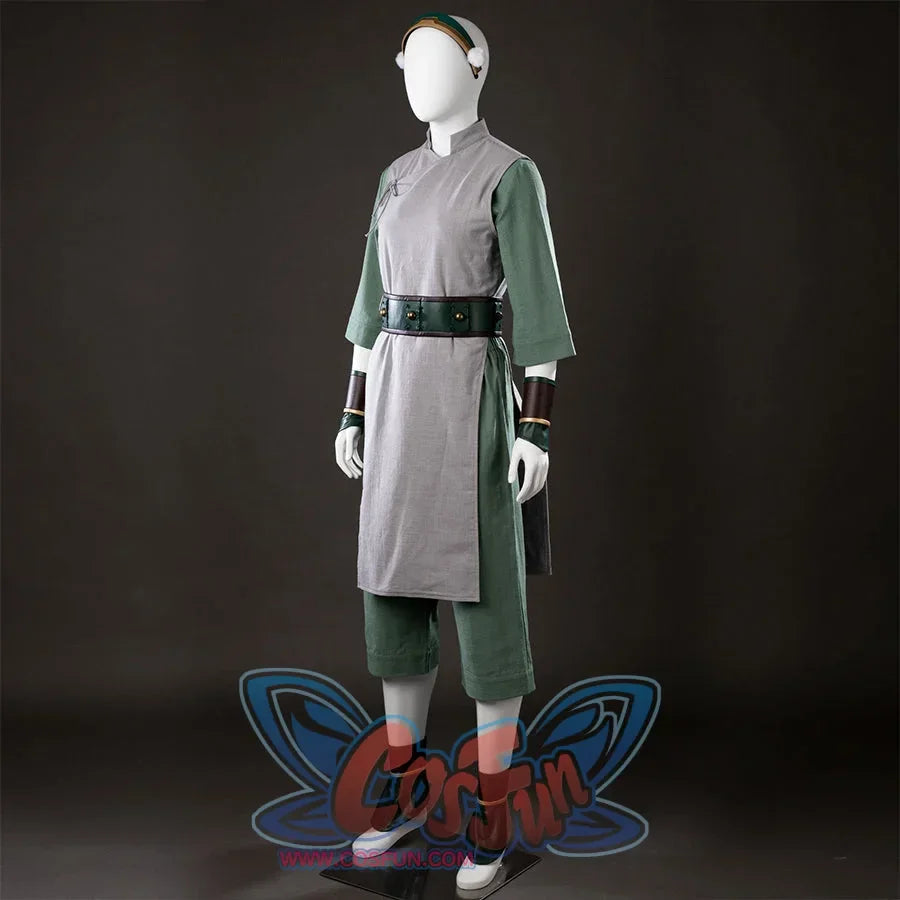 Angled front view of Toph Beifong cosplay costume from Avatar with gray tunic, green pants, belt, and arm guards