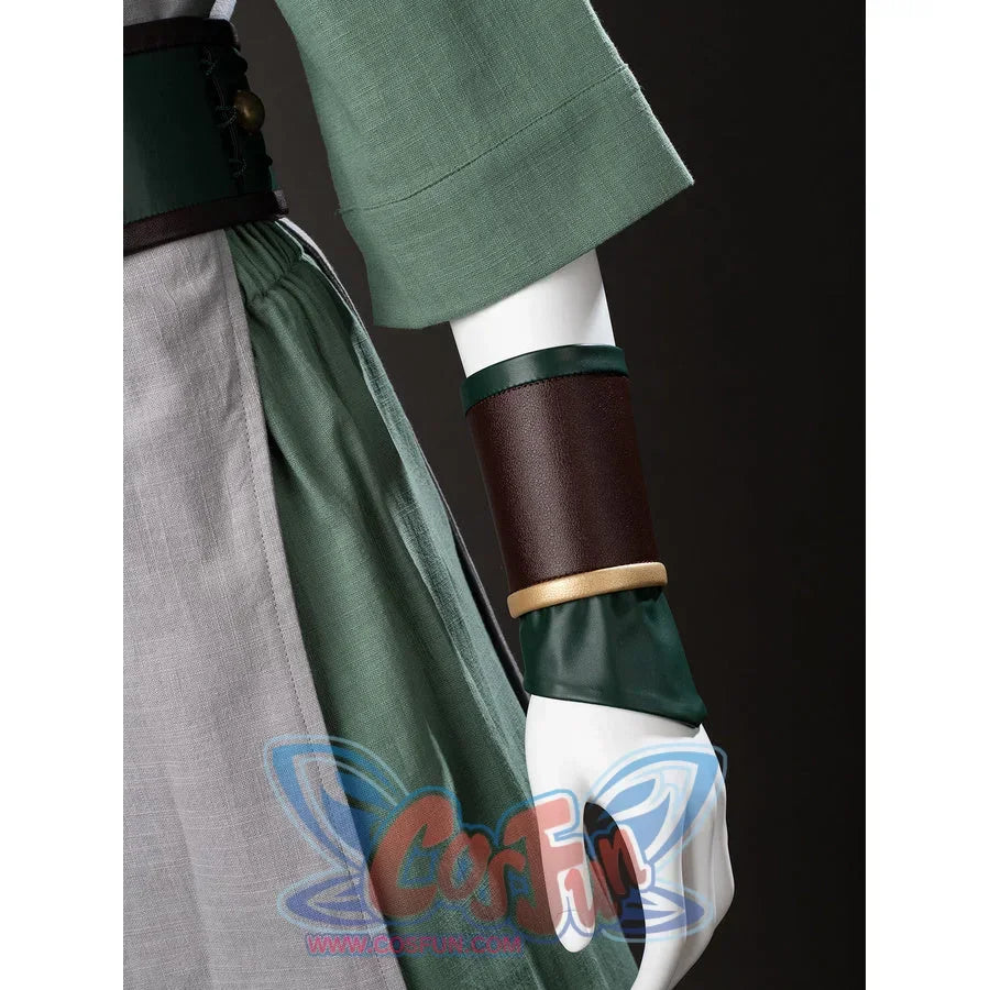 Arm guard close-up of Toph Beifong cosplay costume from Avatar with green glove, brown cuff, and gold trim