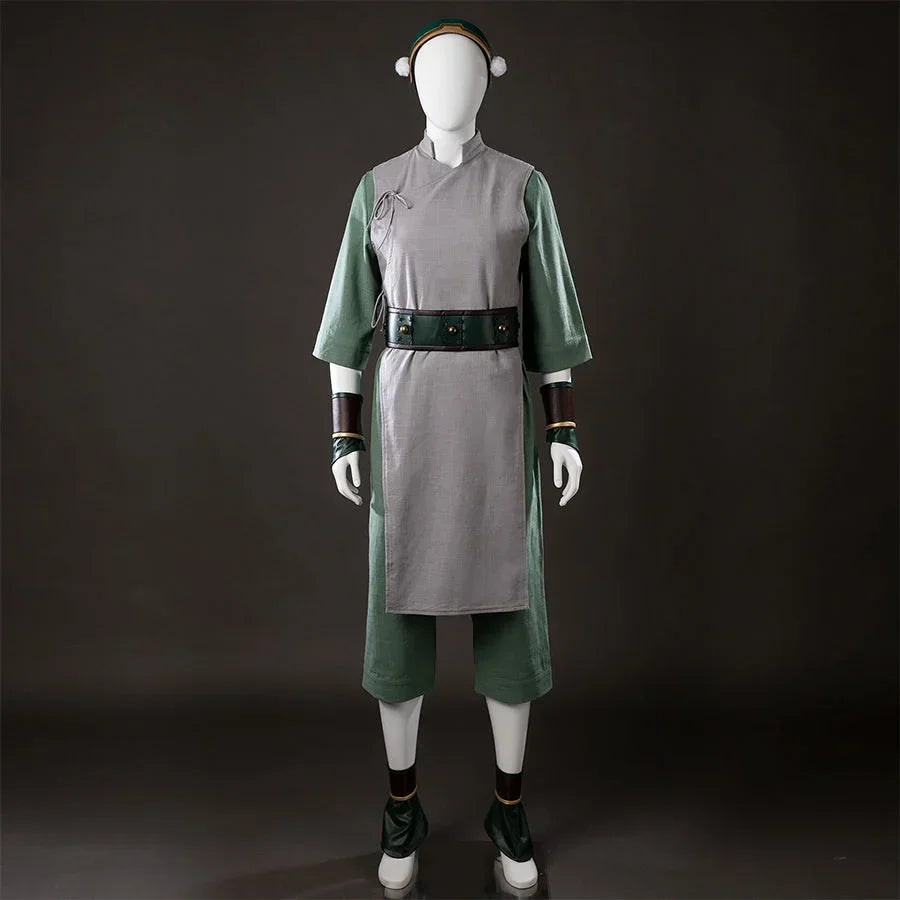 Front view of Toph Beifong cosplay costume from Avatar with gray tunic, green sleeves, belt, headband, and shoe covers
