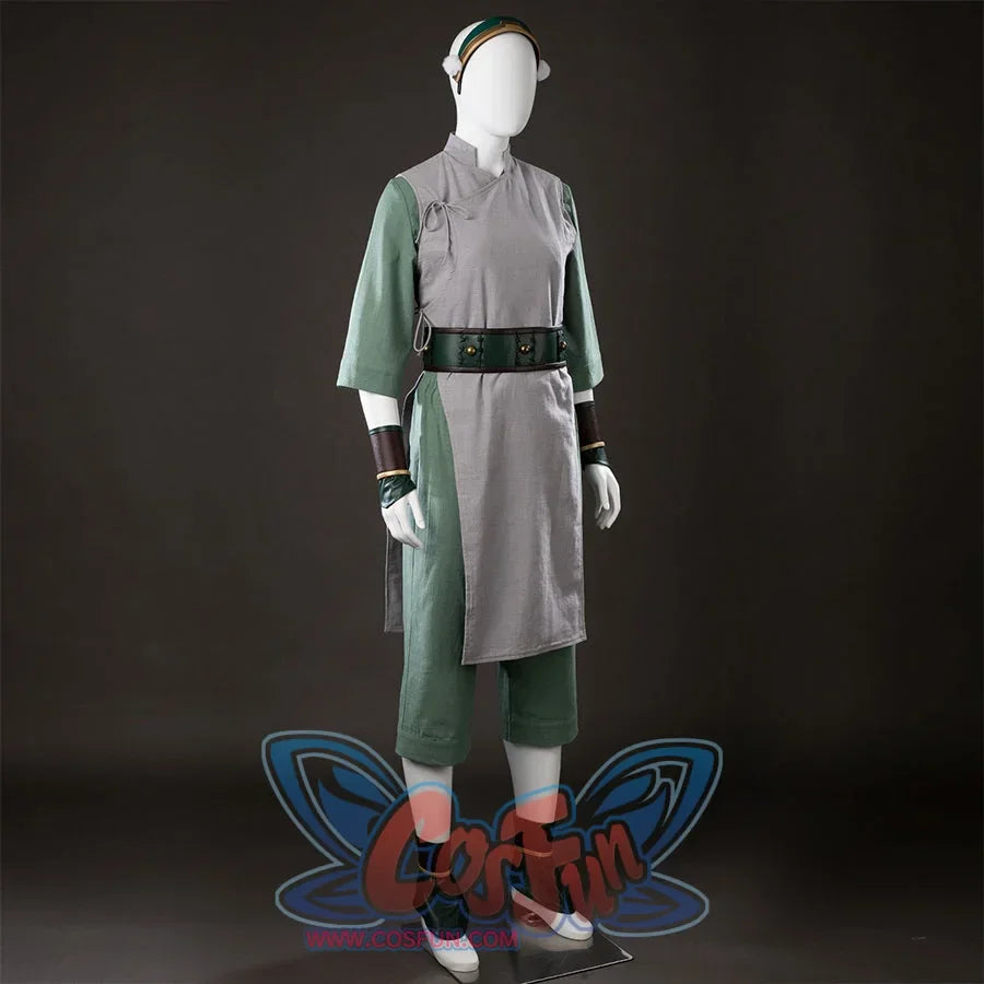 Front angled view of Toph Beifong cosplay costume from Avatar with headband, gray wrap tunic, green sleeves, and belt