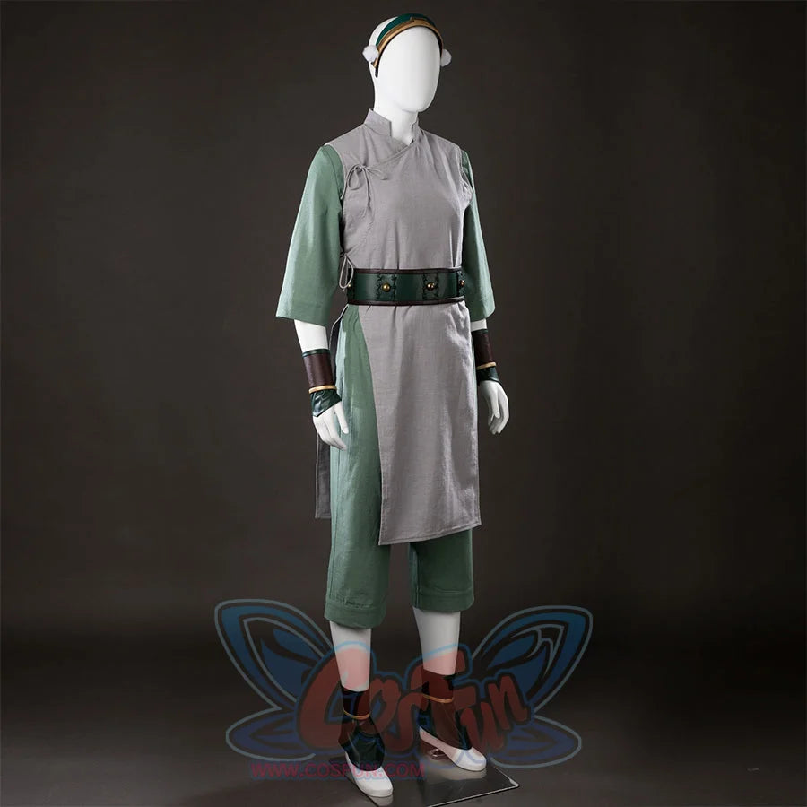 Front angled view of Toph Beifong cosplay costume from Avatar with headband, gray wrap tunic, green sleeves, and belt