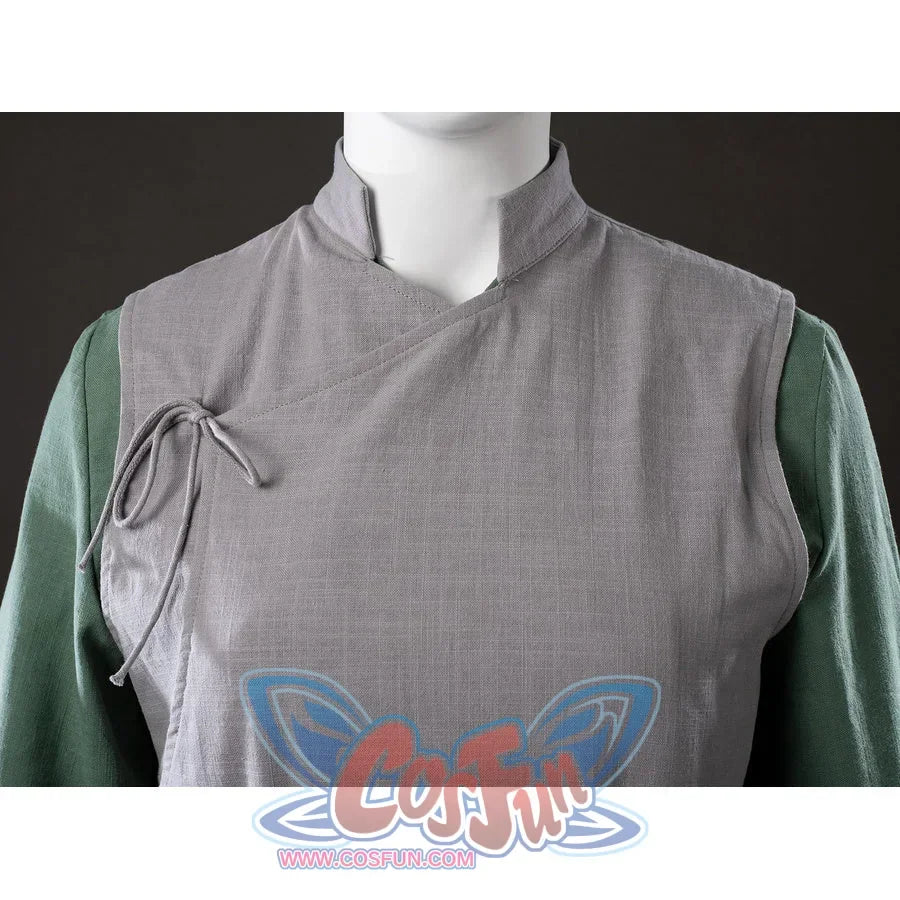 Close-up of Toph Beifong cosplay costume from Avatar showing gray wrap collar, side tie, and green sleeves