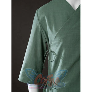 Close-up of Toph Beifong cosplay costume from Avatar green jacket wrap front with side ties and sleeve opening