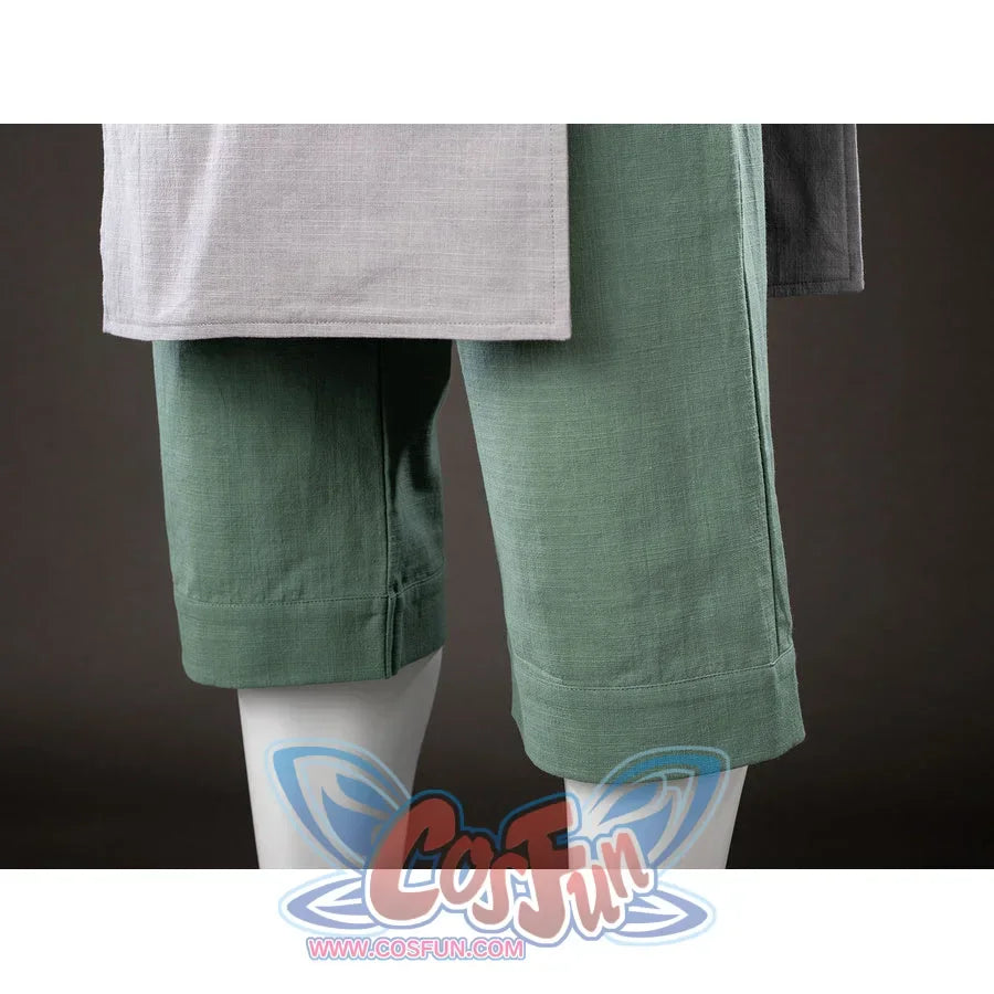 Pants hem close-up of Toph Beifong cosplay costume from Avatar showing green cropped legs and gray tunic edge