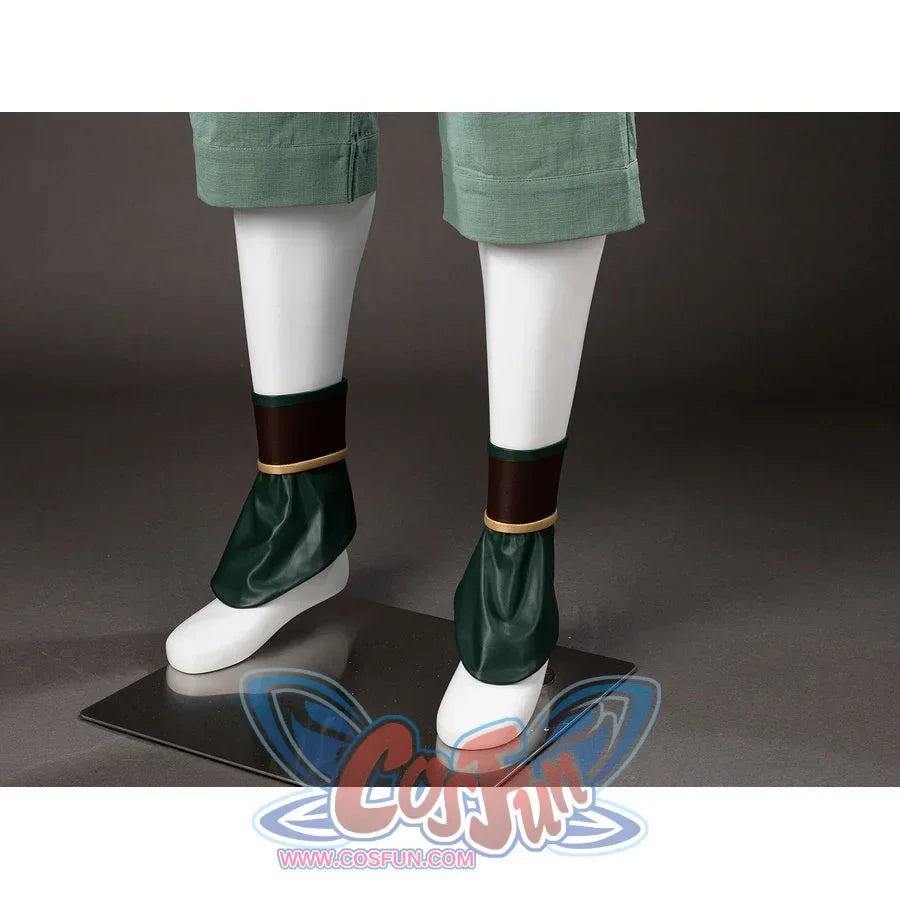 Shoe cover close-up of Toph Beifong cosplay costume from Avatar with green wraps, brown cuffs, and gold trim