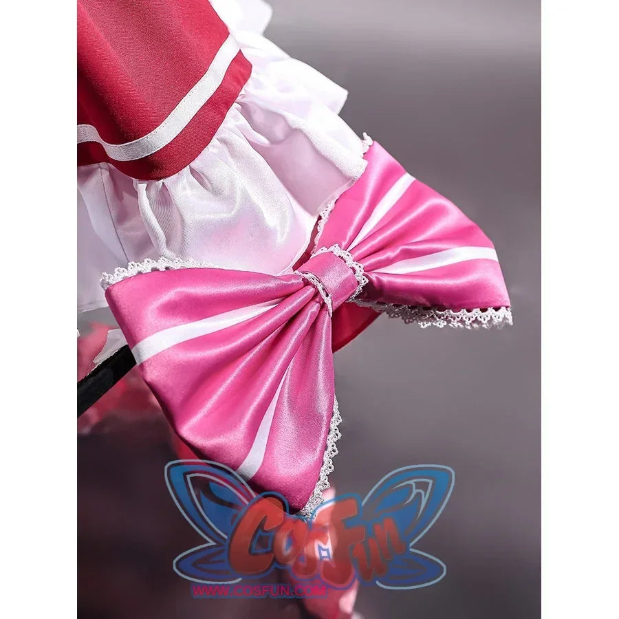 Beatrice cosplay striped waist bow close-up with glossy pink fabric and lace-trimmed tails.