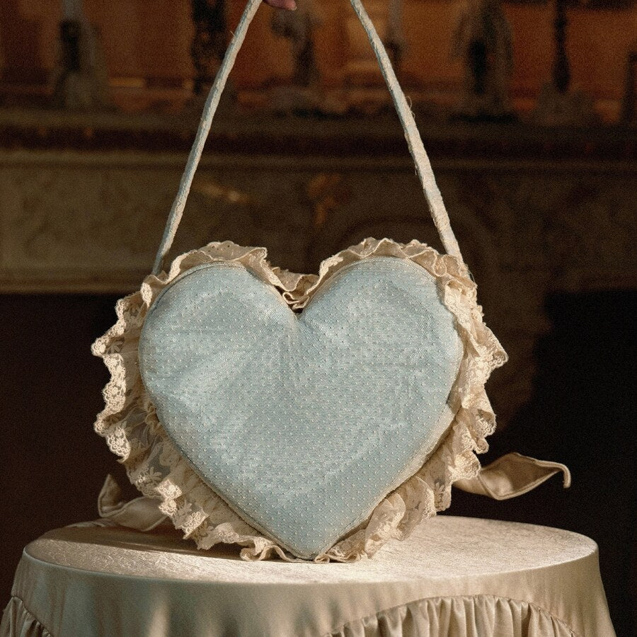 Back view of the blue heart handbag with dotted fabric and lace ruffle edging