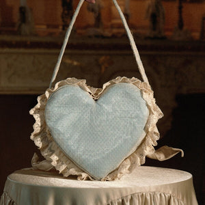 Back view of the blue heart handbag with dotted fabric and lace ruffle edging