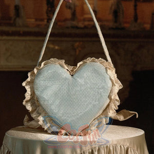 Back view of the blue heart cake handbag with dotted fabric and lace ruffle edging