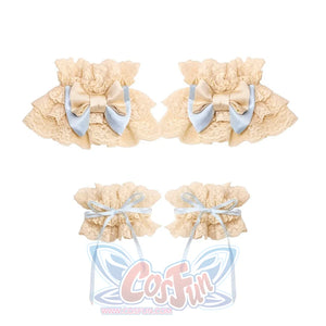 Flat lay of the Bow Arm Cuffs and Hand Sleeves item with cream ruffles and blue bows