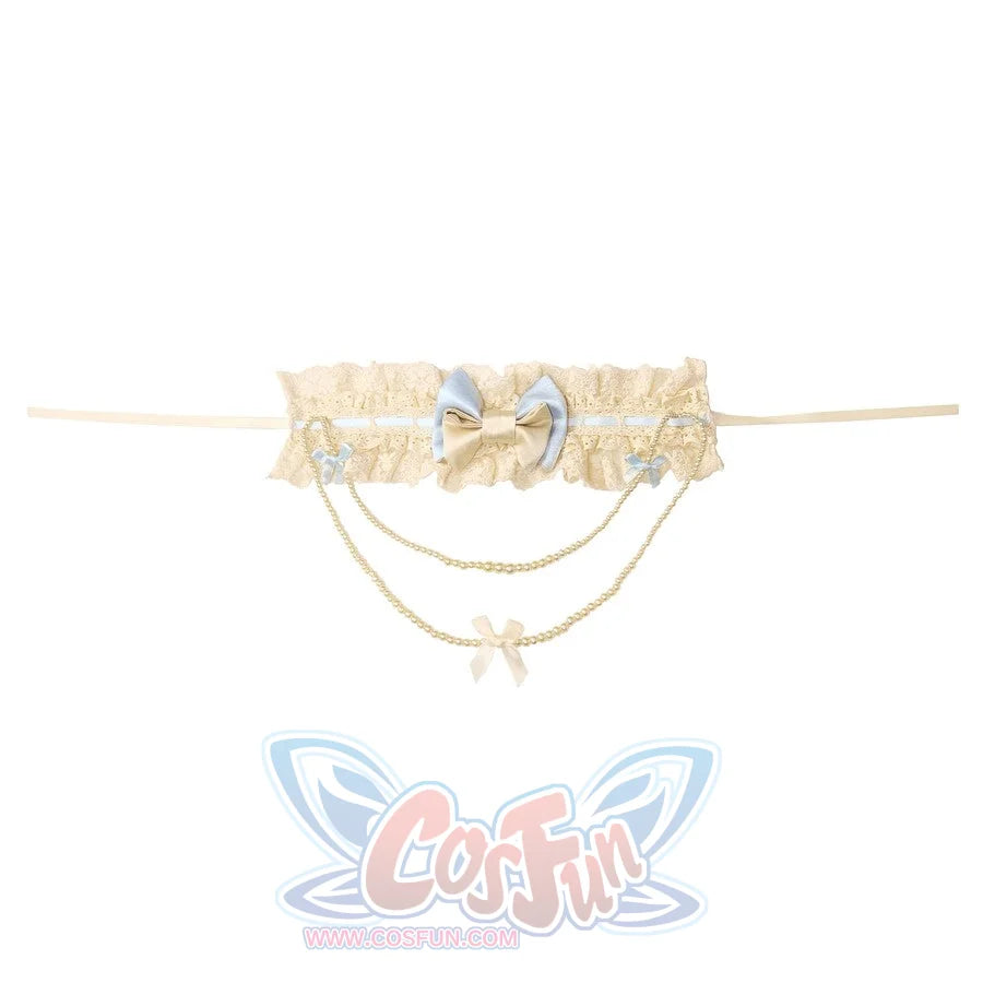 Flat lay of the Butterfly Bow Pearl Necklace item with lace band and chain drape