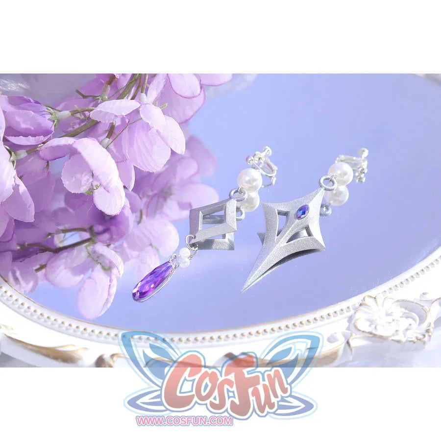 Flat lay of Castorice cosplay costume earrings with silver wing shapes, pearl beads, and purple teardrop charm