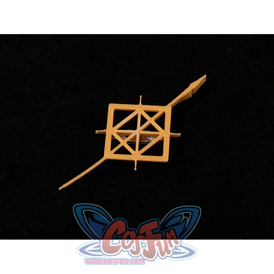 Badge close-up of Maelle cosplay costume from Clair Obscur Expedition 33 showing gold geometric pin on black fabric