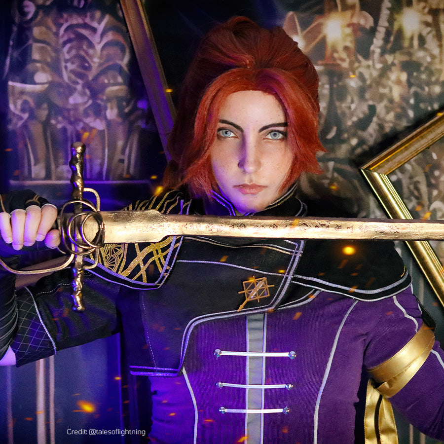 Clair Obscur: Expedition 33 Maelle cosplay costume portrait sets a prop sword across the purple and black bodice.