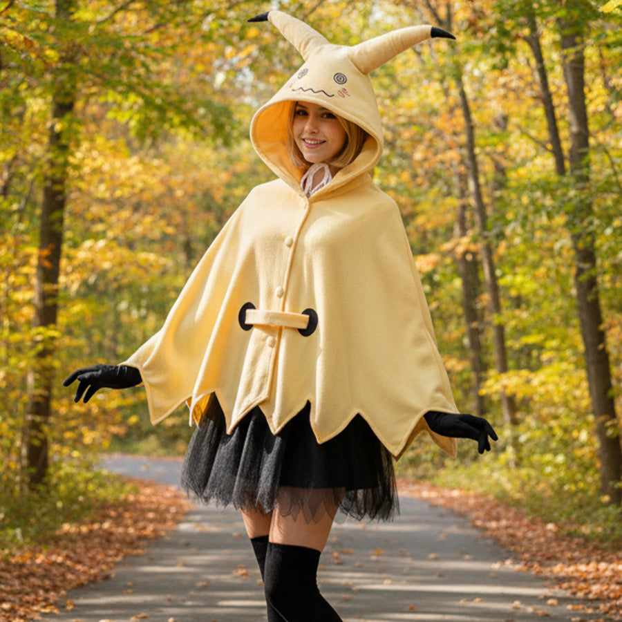 Model wearing yellow spark cute cape dress with hood and black tutu skirt in autumn forest