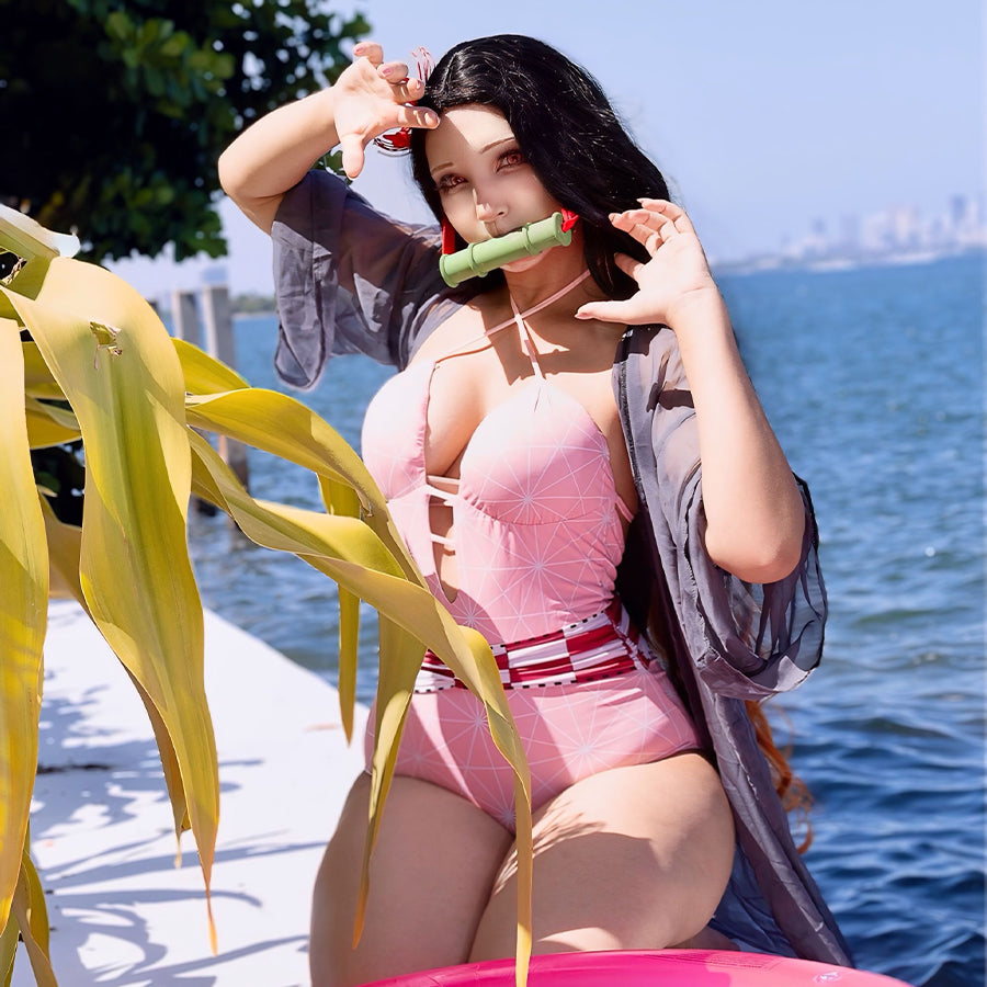 COSFUN Nezuko cosplay swimsuit layers a pink geometric bodysuit beneath a sheer black cover-up.