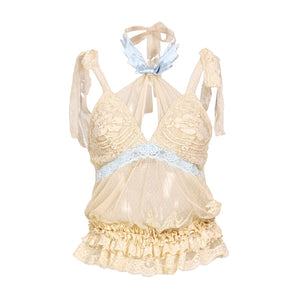 Cream halter camisole flat lay with lace cups, sheer body, and blue bow collar