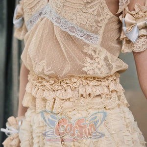 Close-up of the Halter camisole item with ruffled hem, sheer dotted mesh, and cream lace texture