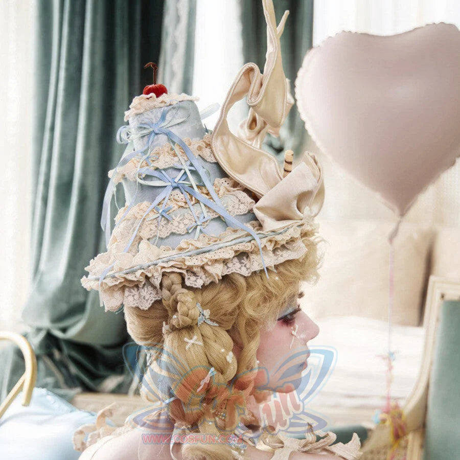 Side view of the Cream Pointed Hat item showing lace trim and ribbon streamers