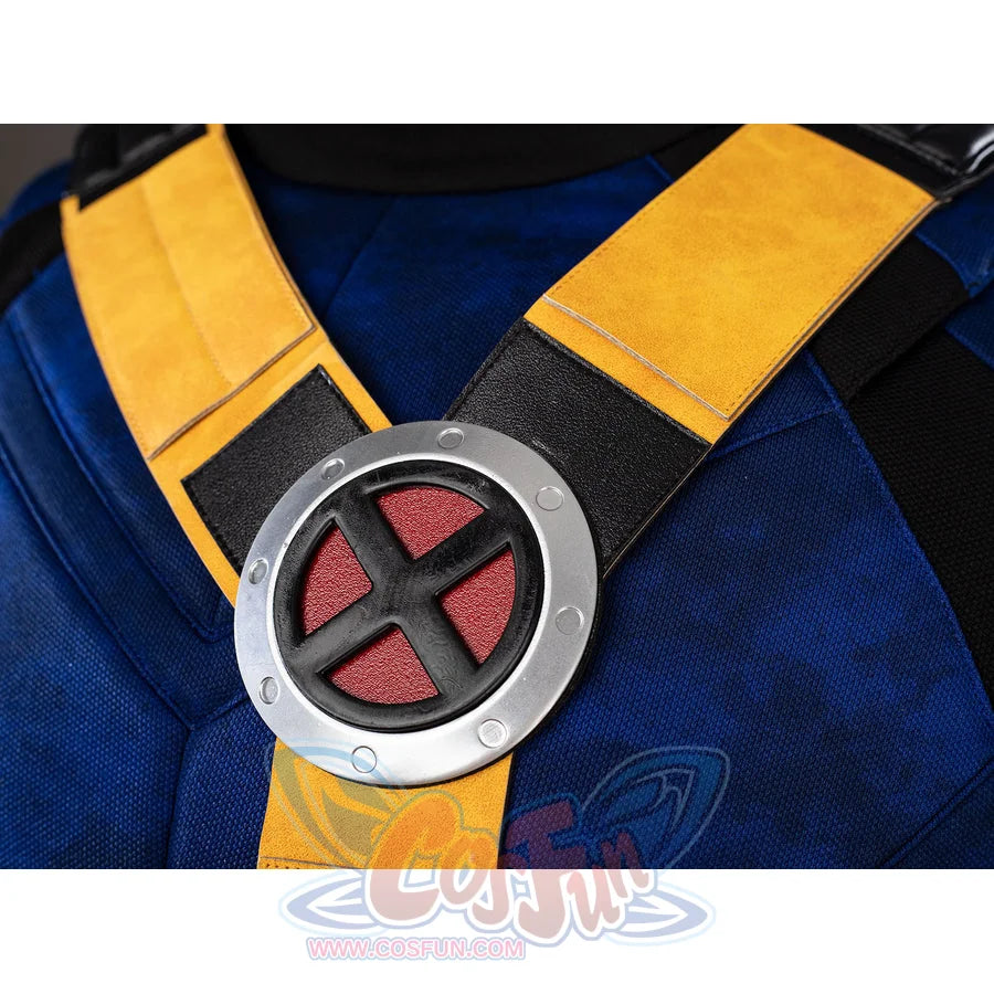 Cyclops cosplay chest emblem close-up anchors the yellow harness over blue fabric.