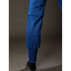 Cyclops Scott Summers cosplay pants leg detail frames a tapered blue cuff above black trim.