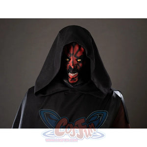 Darth Maul cosplay latex headpiece close-up sits beneath a black hood with red face markings and horns.