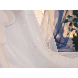 Denia cosplay costume layers delicate white glitter mesh fabric with subtle metallic gold-tone decorative stitching accents.