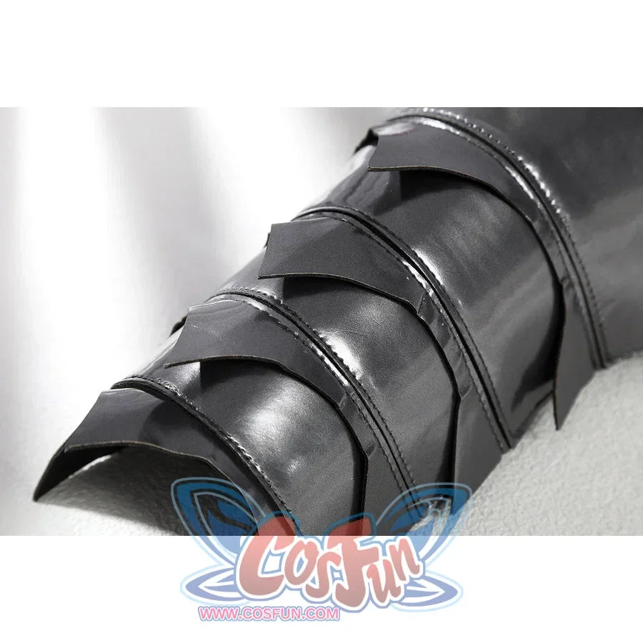 Diana Prince cosplay lower leg armor close-up stacks dark silver plates above black trim