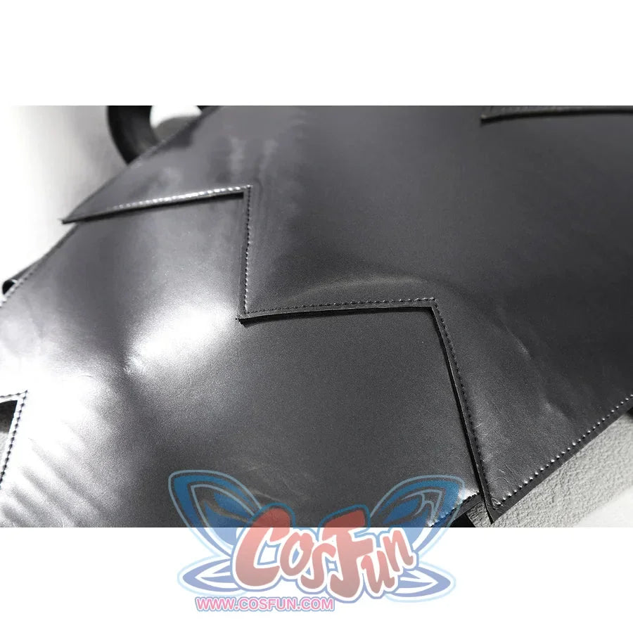 Diana Prince cosplay shoulder armor close-up frames a curved silver plate with sharp stepped edges