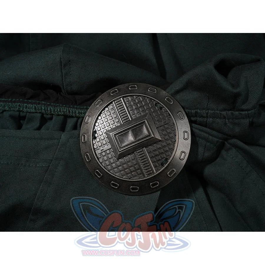 Doctor Doom cosplay cape clasp close-up with a round dark face and silver-tone edge.