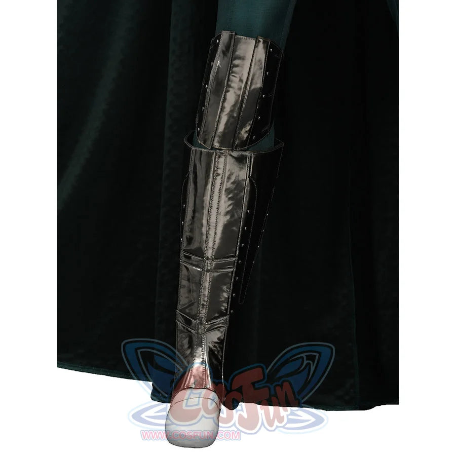 Doctor Doom cosplay shin armor close-up with layered silver-tone panels beside the cape.