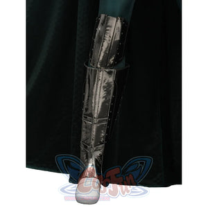 Doctor Doom cosplay shin armor close-up with layered silver-tone panels beside the cape.