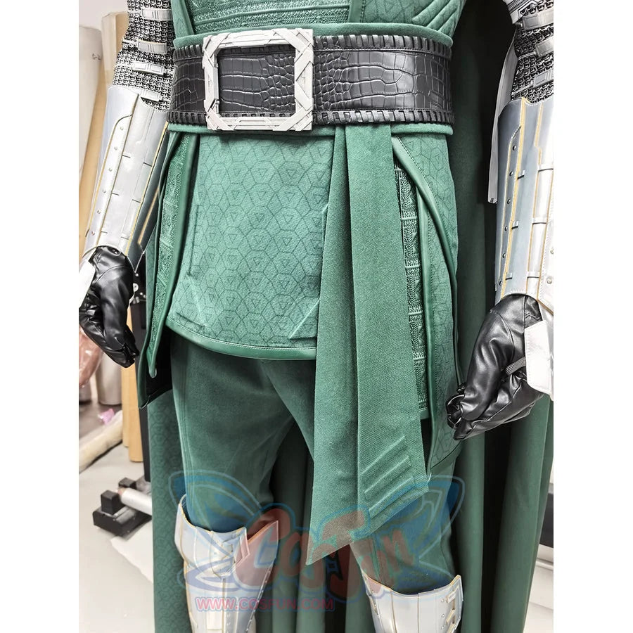 Doctor Doom cosplay costume pairs a textured green tunic layered under a black waist cincher with metallic armor pieces.