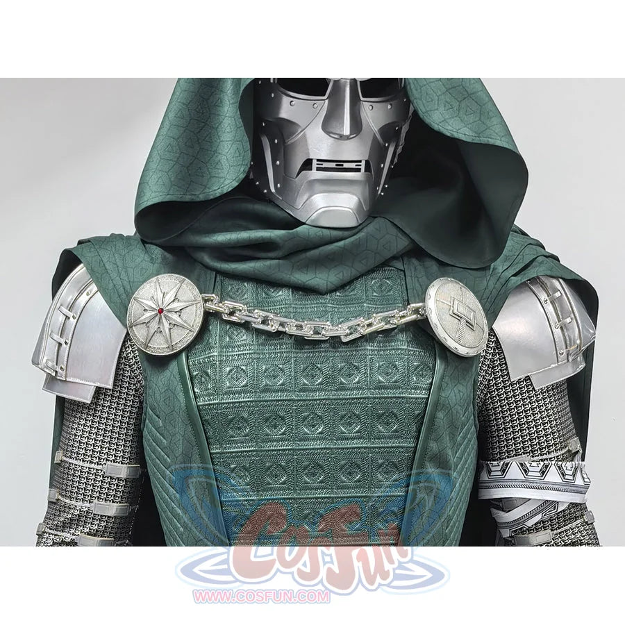 Doctor Doom cosplay costume anchors silver-tone shoulder armor with a chain across a textured green tunic and dark hood.