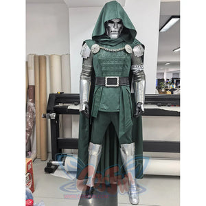 Doctor Doom cosplay costume layers a green hooded cape over metallic shoulder armor and patterned tunic with leg guards.