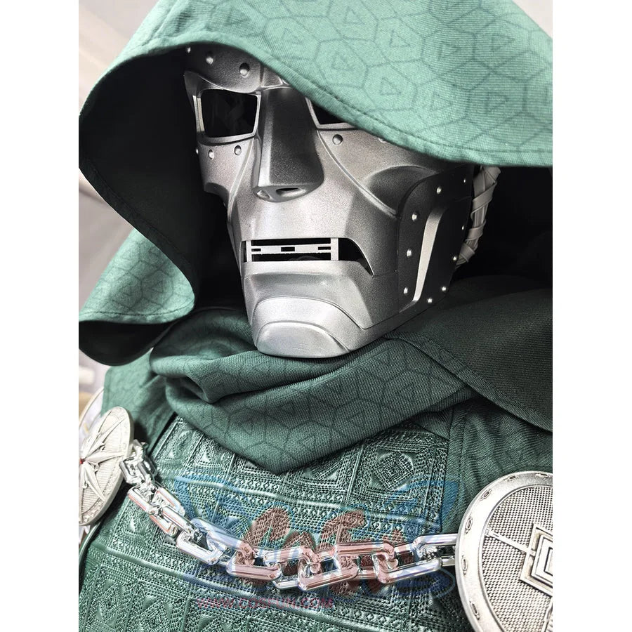 Doctor Doom cosplay mask centers silver-tone facial armor with green hooded textured cloak and metal chest chain.